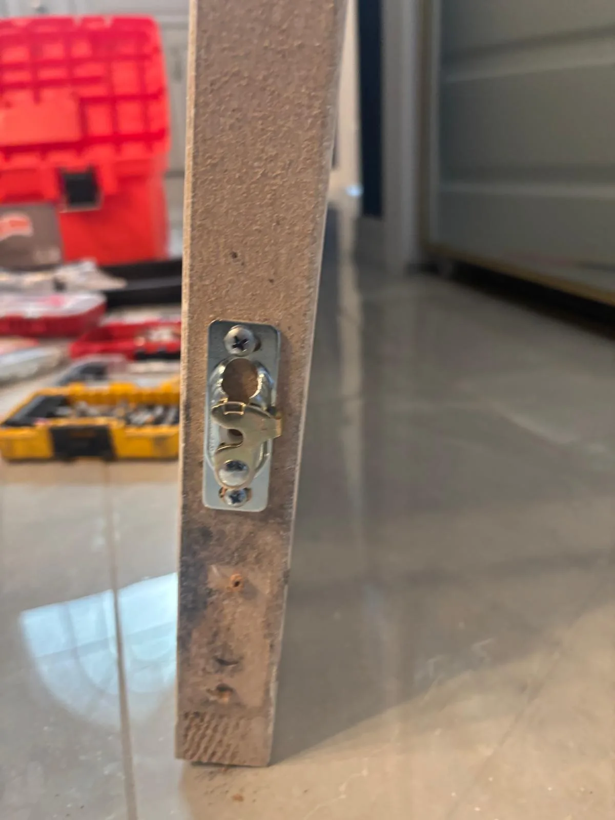 Our technician adjusting pocket door track hardware in a Stuart home