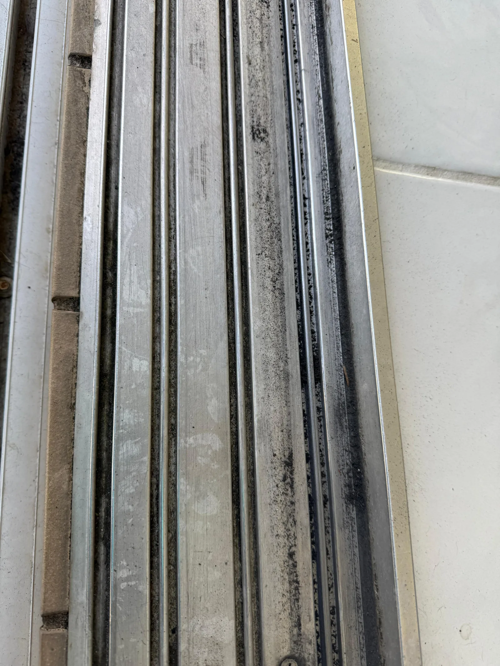 Dirty sliding door track that needs repair