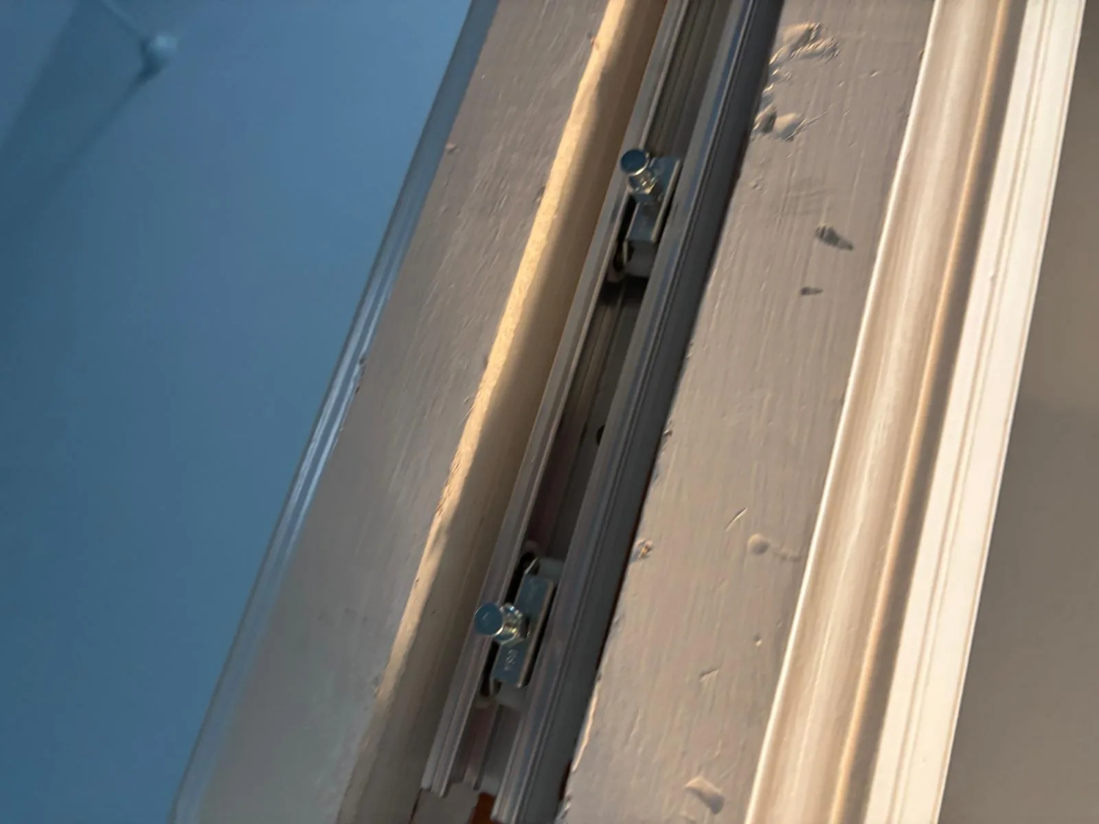 Repairing the overhead track inside a pocket door cavity