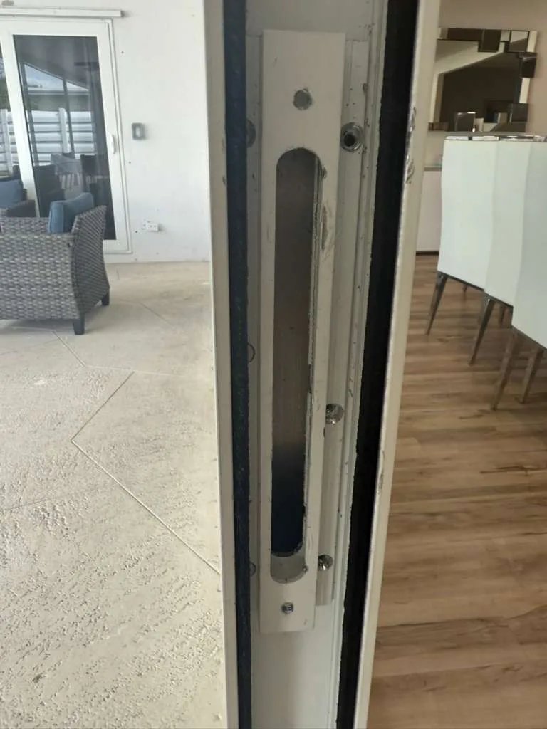 Removing a broken sliding door lock for replacement